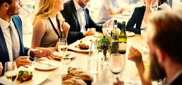 large group of people enjoying dinner together